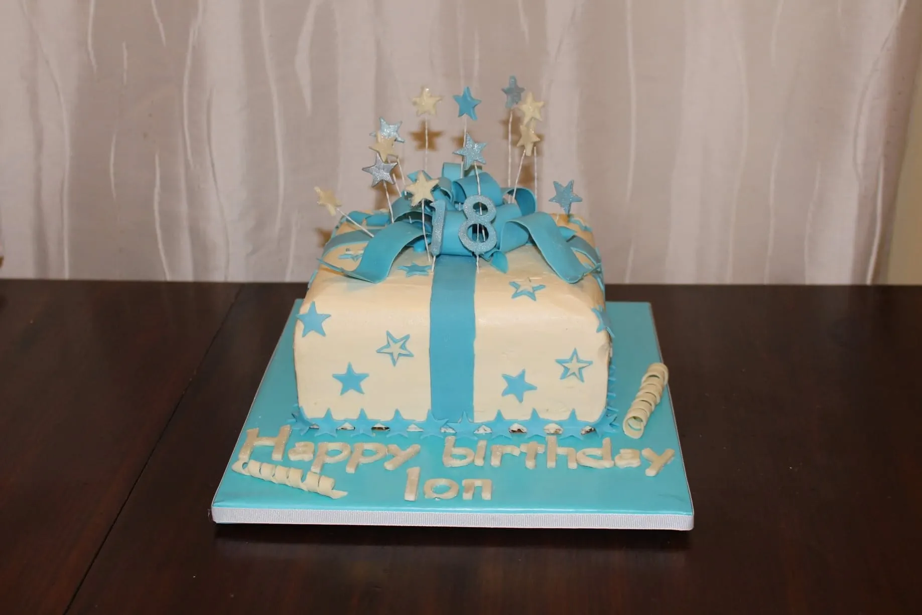 Blue and white gift box cake for an 18th birthday