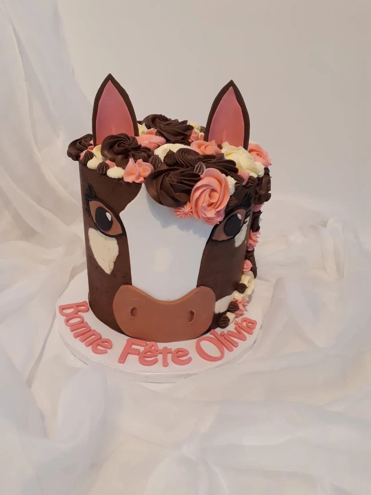 Brown horse face birthday cake with a flower crown