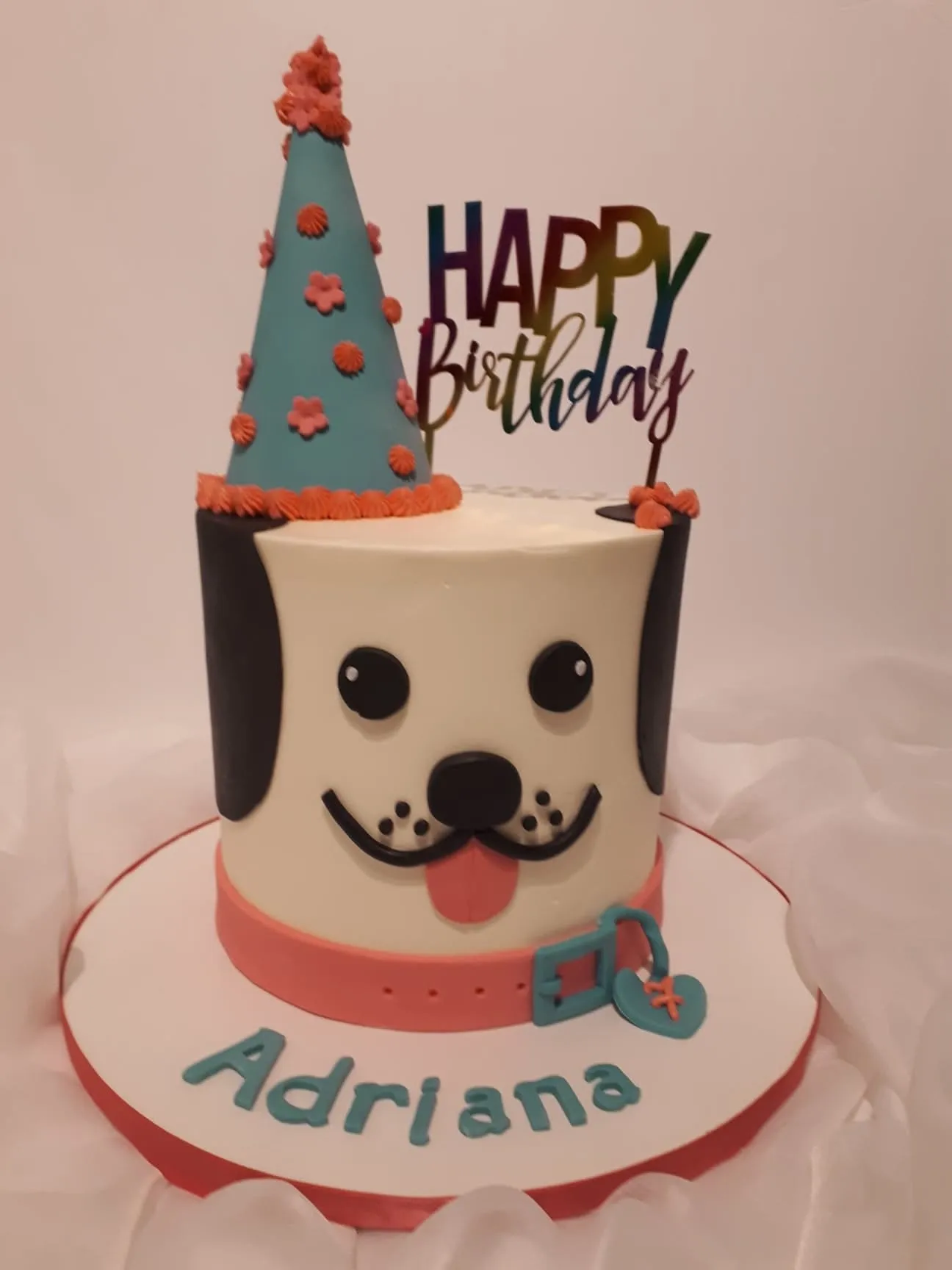 Puppy face birthday cake with a party hat