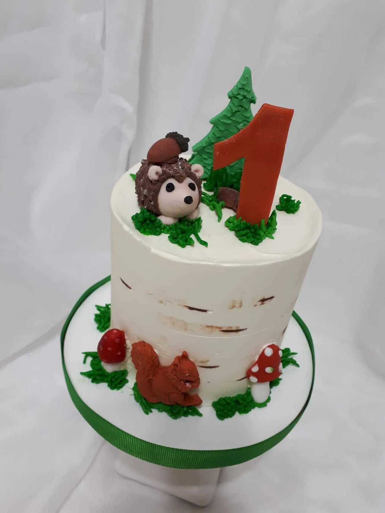First birthday cake with a hedgehog and mushrooms