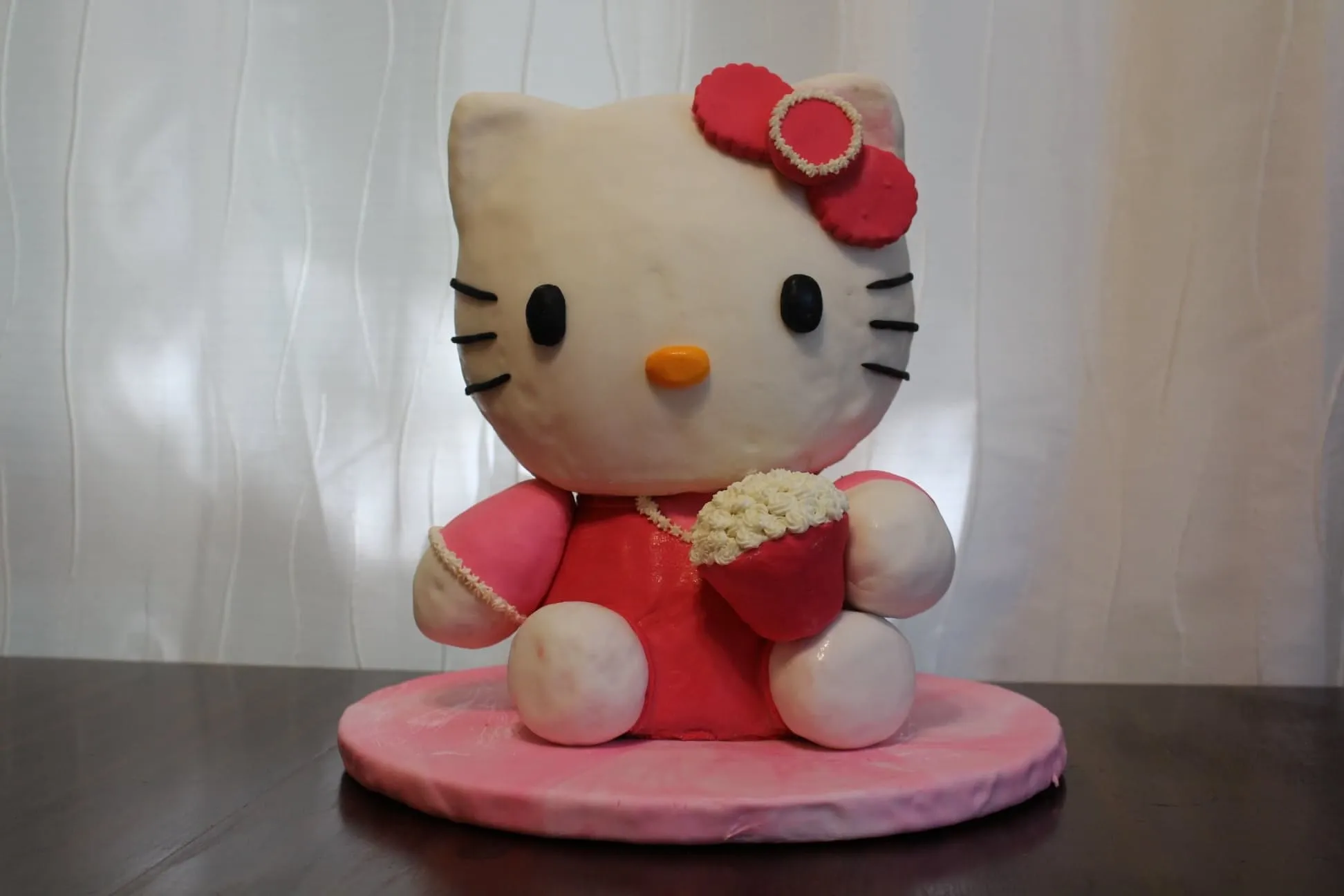 3D Hello Kitty cake in a pink dress