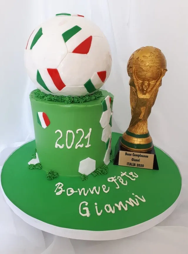 Soccer birthday cake in Italian colours with a trophy